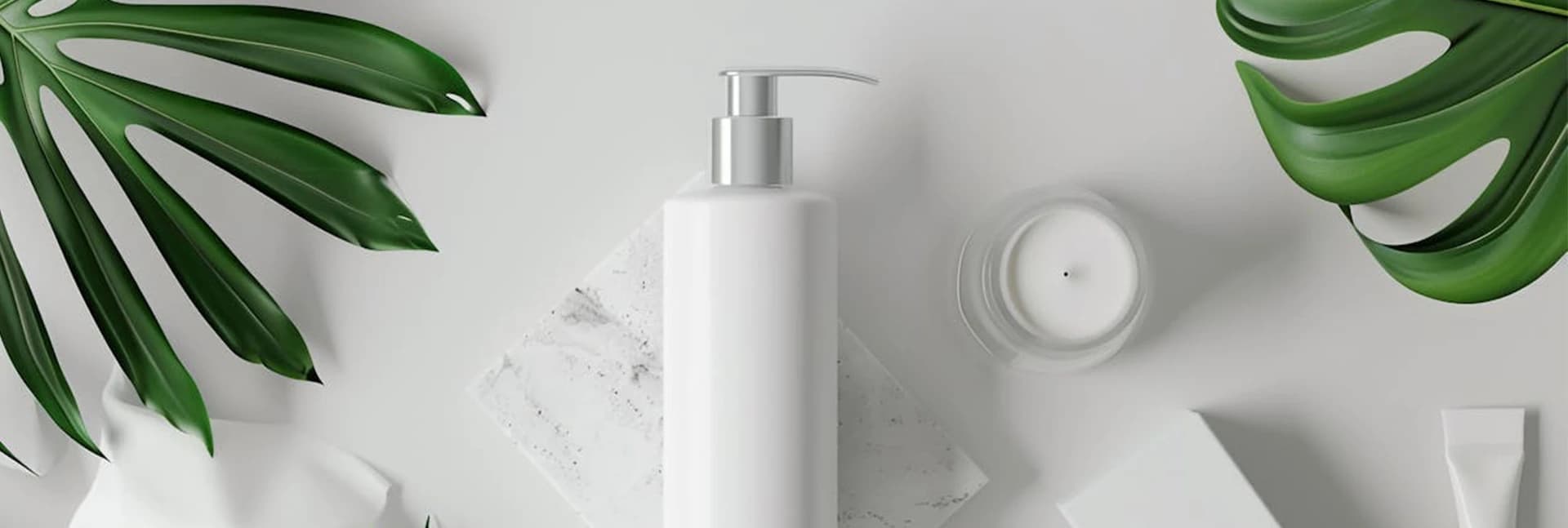 White pump bottle and jar on a light background