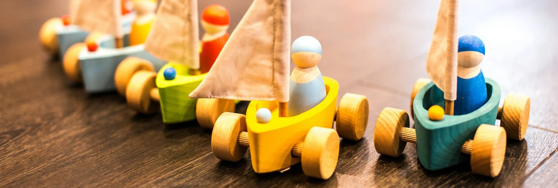 Wooden toy boats with peg figures