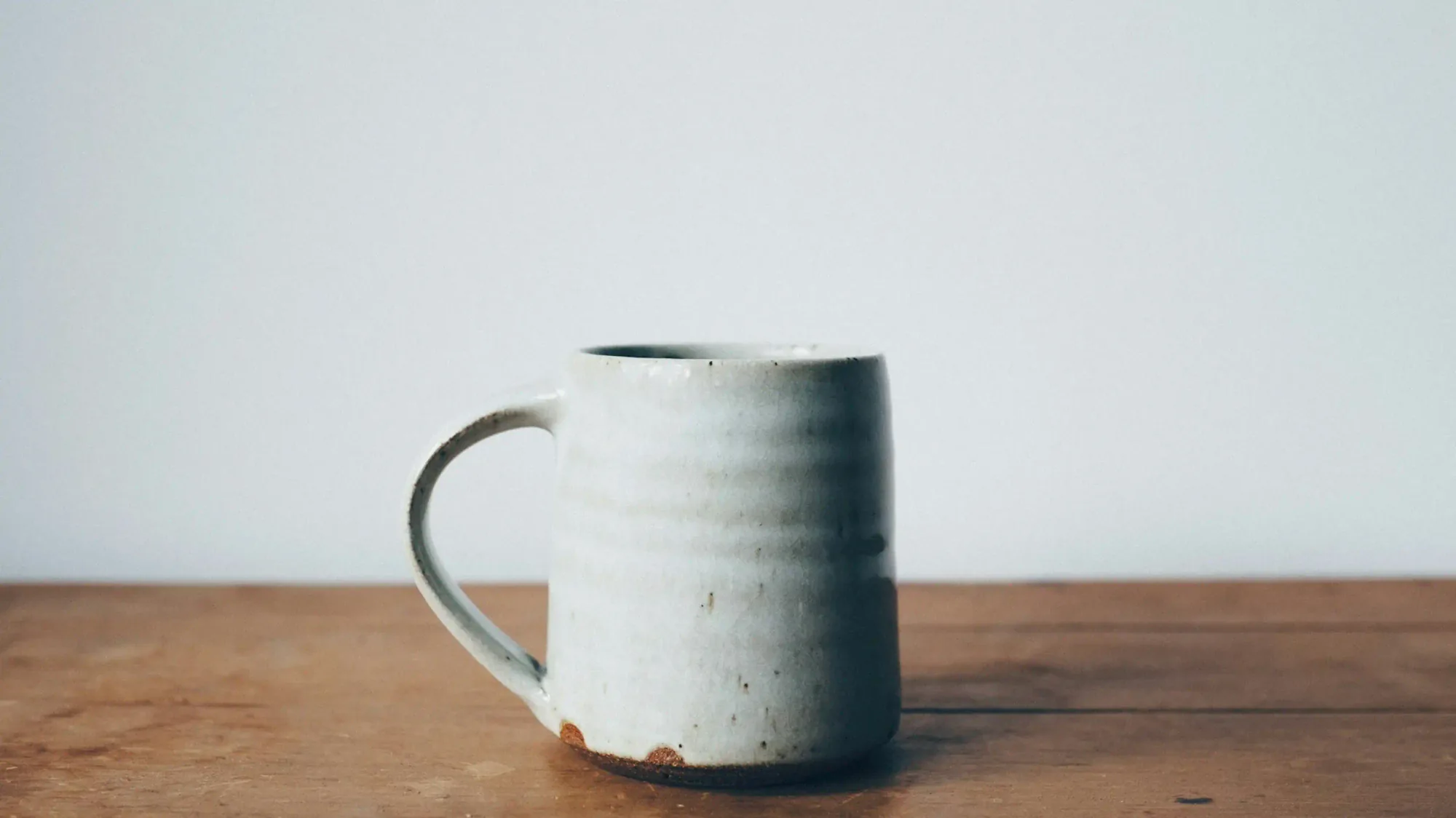 handmade ceramic mug in green with handle