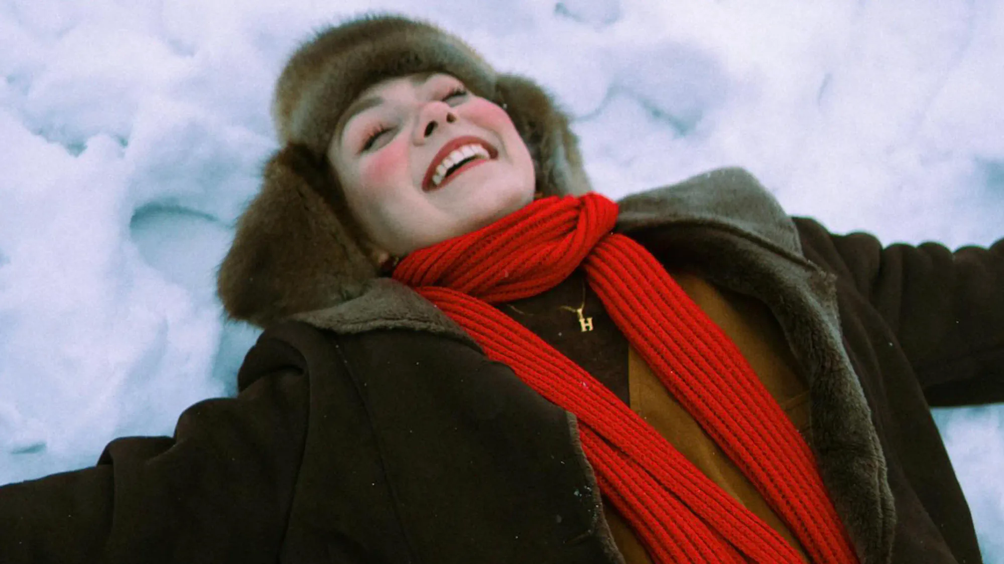 red scarf worn in the snow